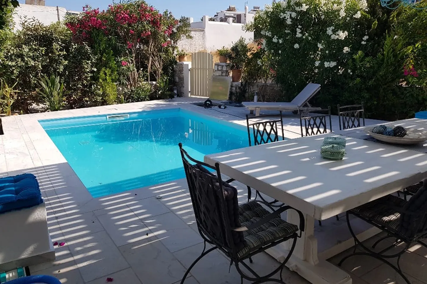Private pool and outdoor dining at Villa Nausithoe